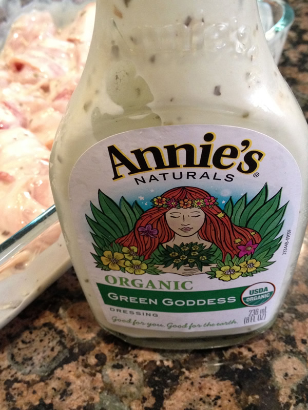 Annie's Organic Green Goddess Dressing with the bacon-wrapped chicken in the background