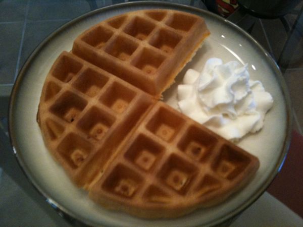 Pac-Man (waffle) eating a pac-dot (whip cream)