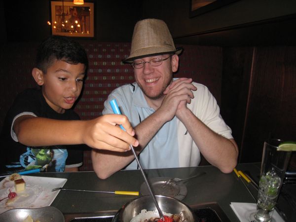 Gaetano dipping into the chocolate